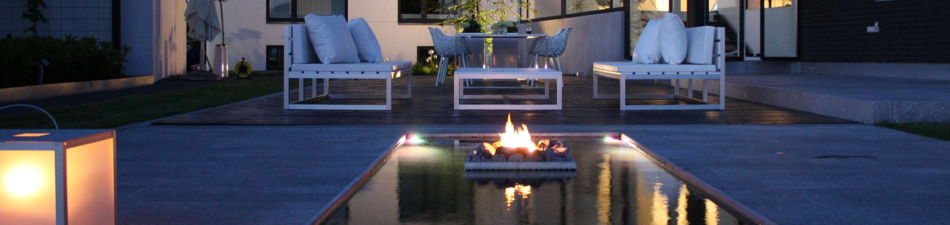 Spejlbassin med Olymp Fireplace designet af havearkitekt Tor Haddeland